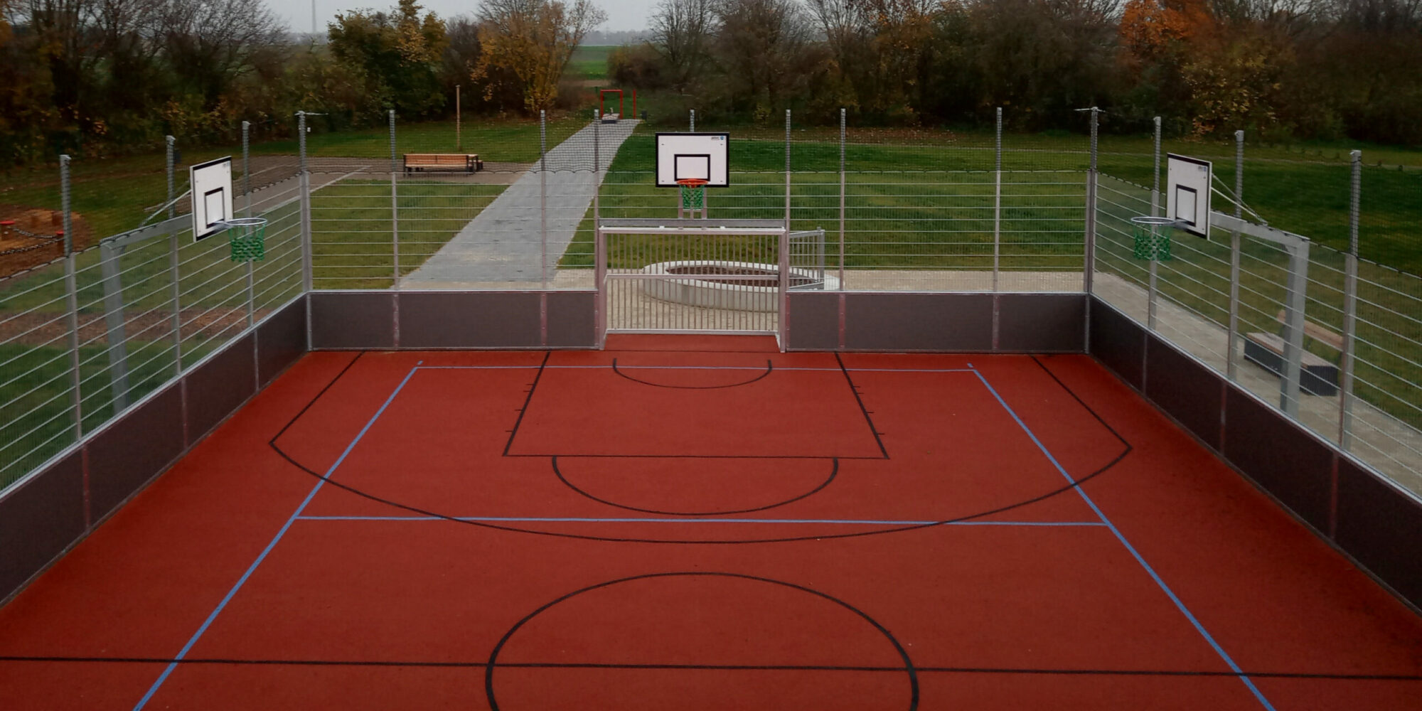 Small sports field with basketball stands